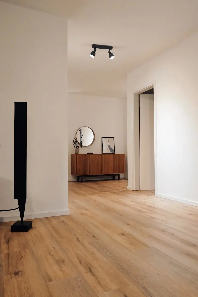 black tower speaker beside white wall on new finished drywall